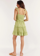 Strappy pale green mini dress with tie shoulders