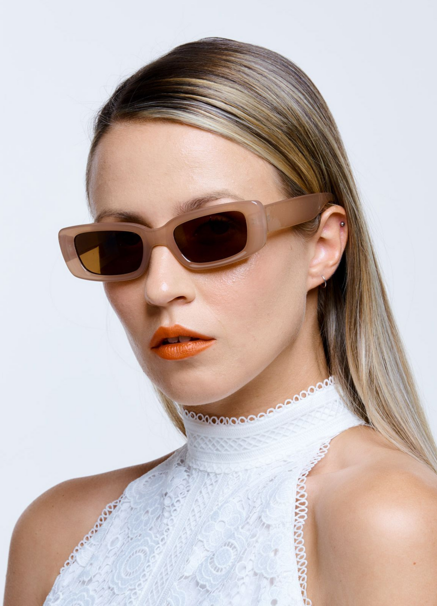 Model wearing nude reality sunglasses