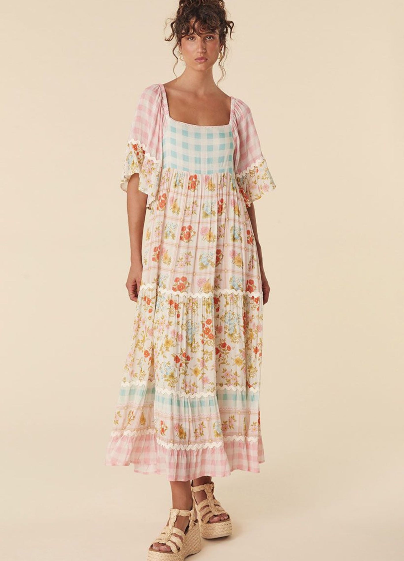 Model wearing the pastel flora gown from Spell