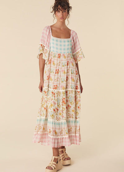 Model wearing the pastel flora gown from Spell