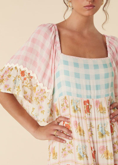 Model wearing the pastel flora gown from Spell