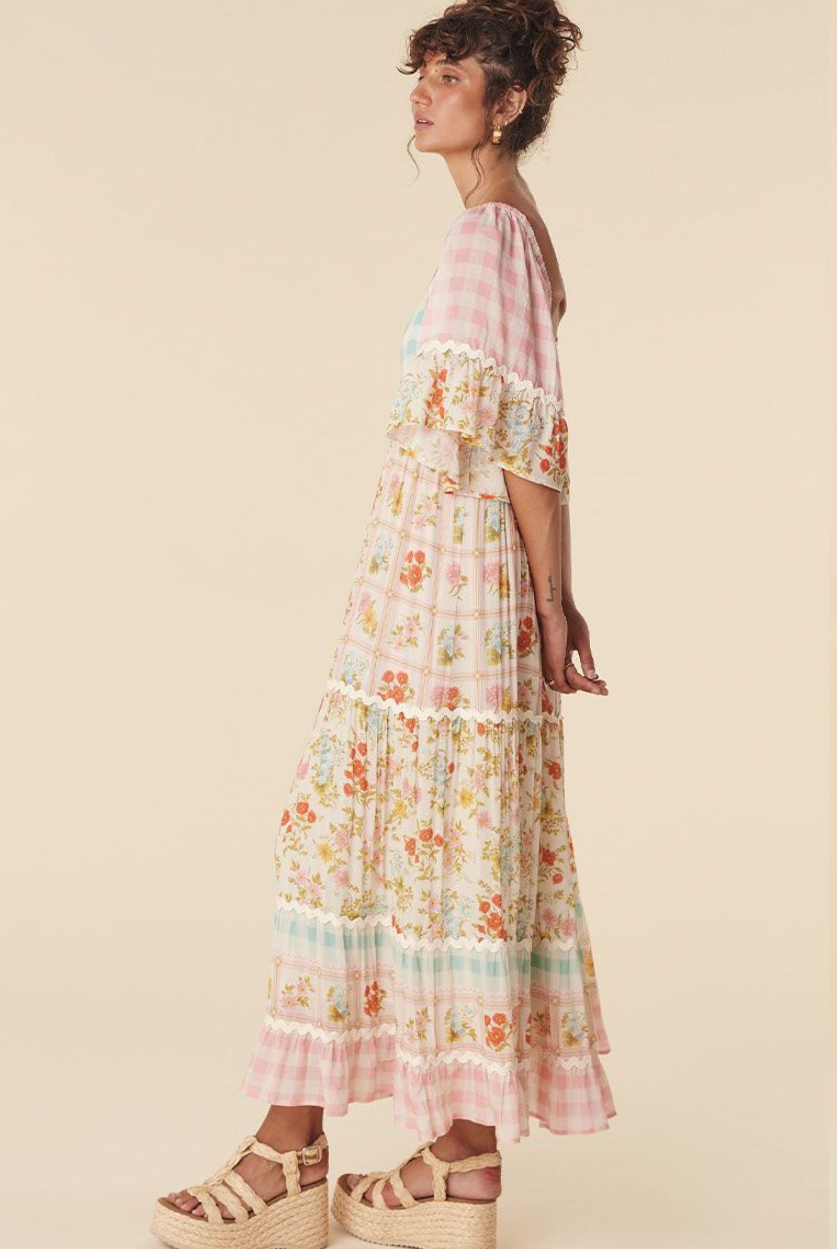Model wearing the pastel flora gown from Spell