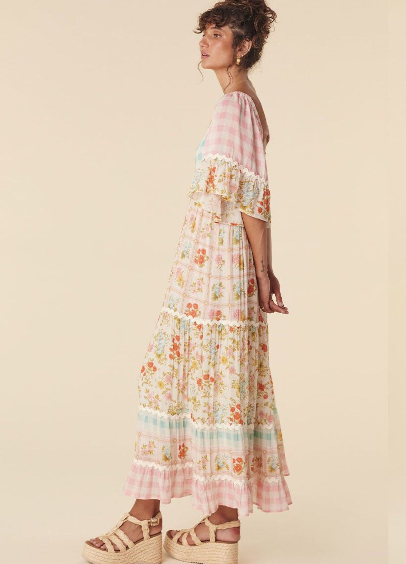Model wearing the pastel flora gown from Spell
