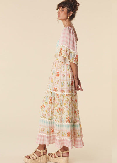 Model wearing the pastel flora gown from Spell