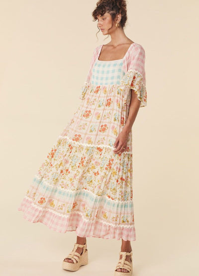 Model wearing the pastel flora gown from Spell