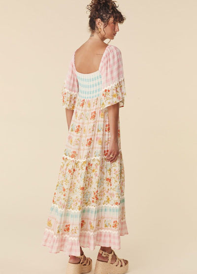 Model wearing the pastel flora gown from Spell