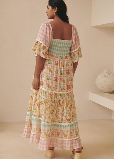 Model wearing the pastel flora gown from Spell
