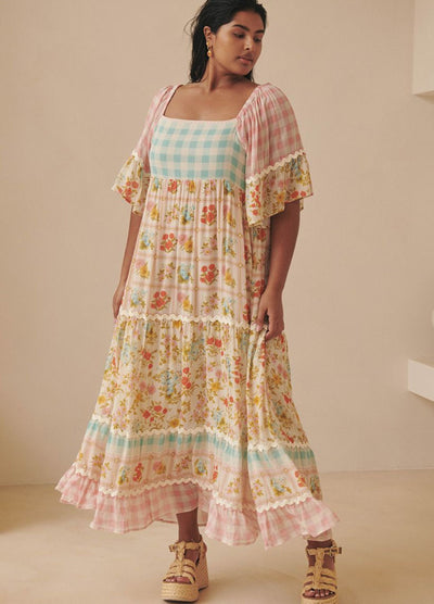 Model wearing the pastel flora gown from Spell