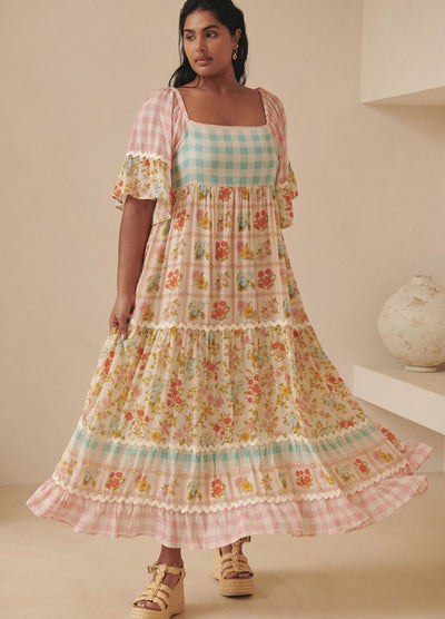 Model wearing the pastel flora gown from Spell