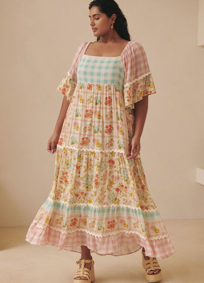 Model wearing the pastel flora gown from Spell