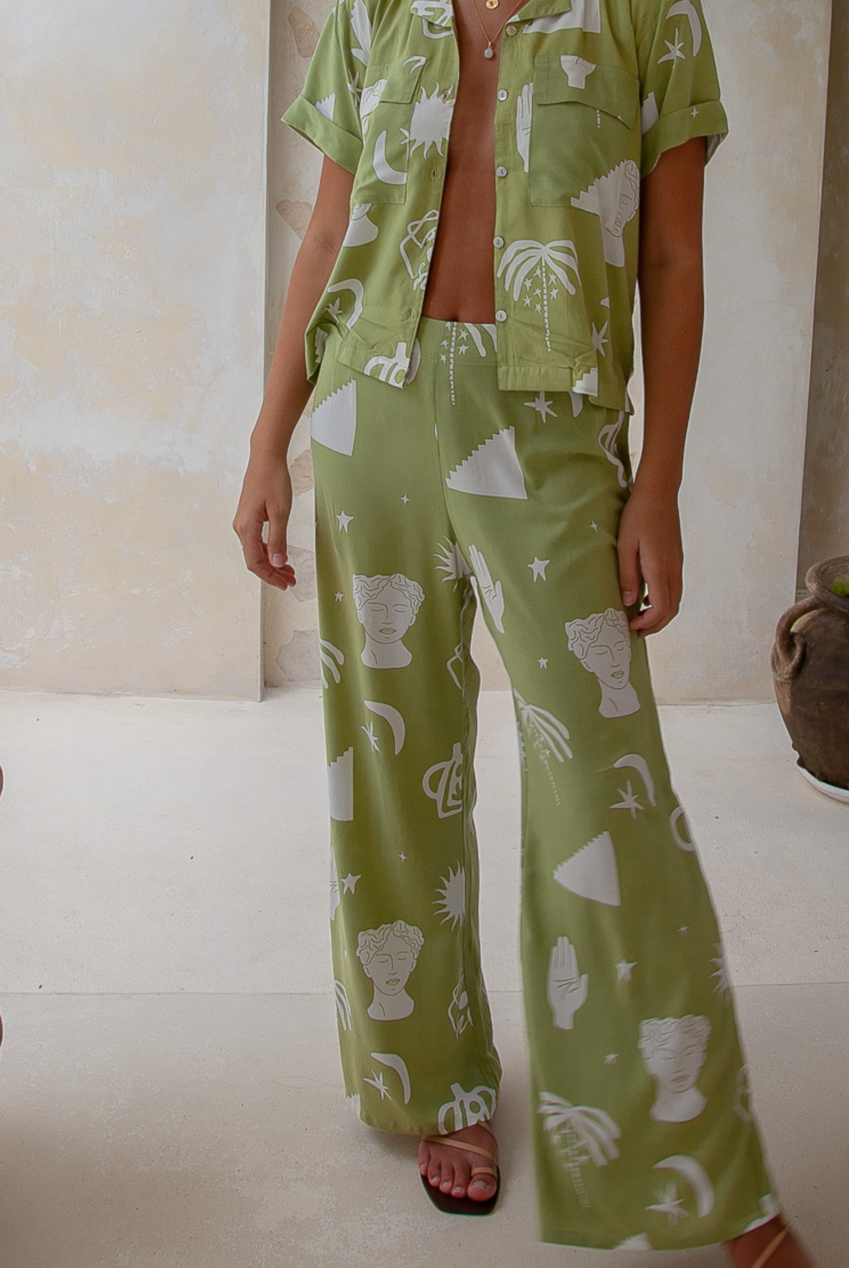 Model wearing the moss green vessel pants from Palm Collective