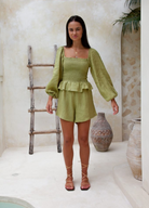 Moss green sustainable linen playsuit from Palm Collective