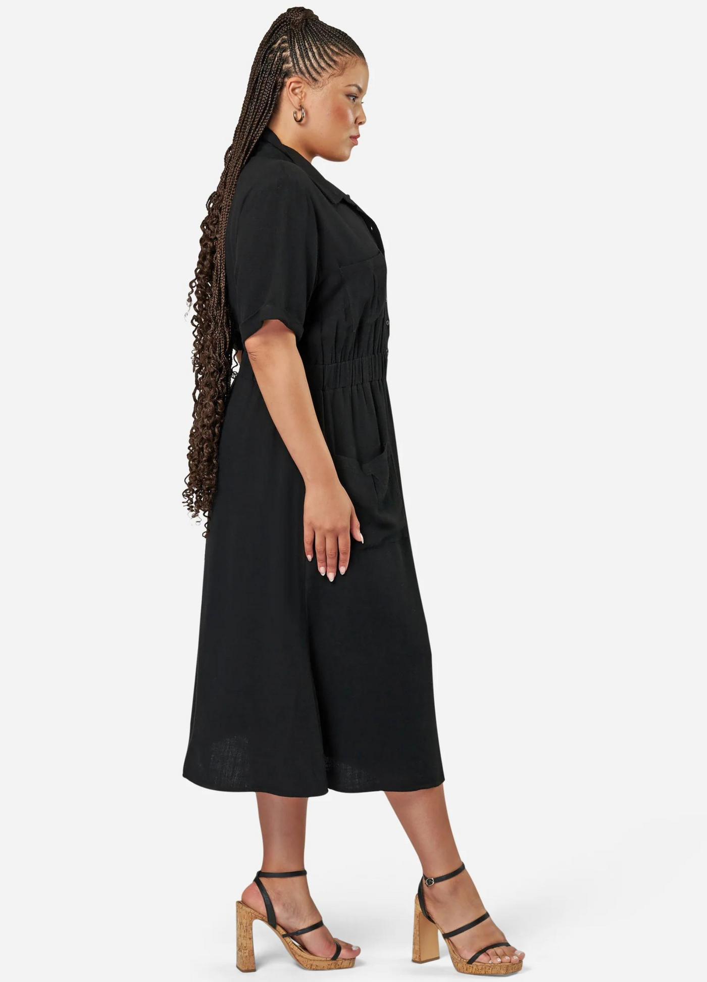 Curve model wearing a black shirt dress