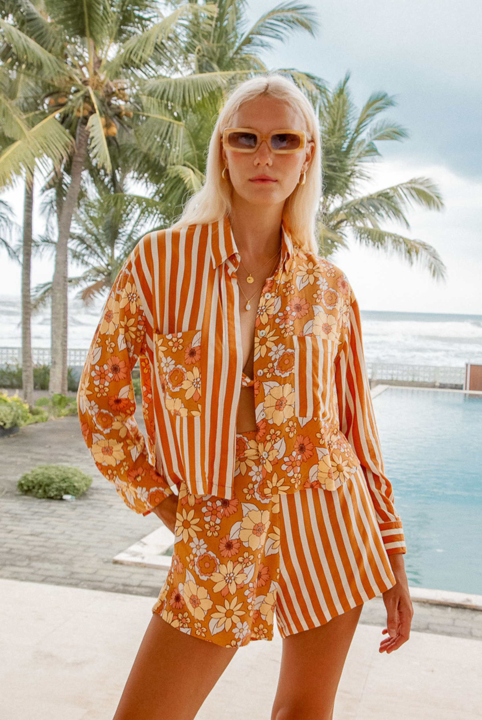 Model wearing the Sunshine Blouse from Palm Collective