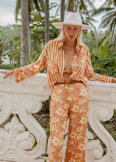 Model wearing the Sunshine Blouse from Palm Collective