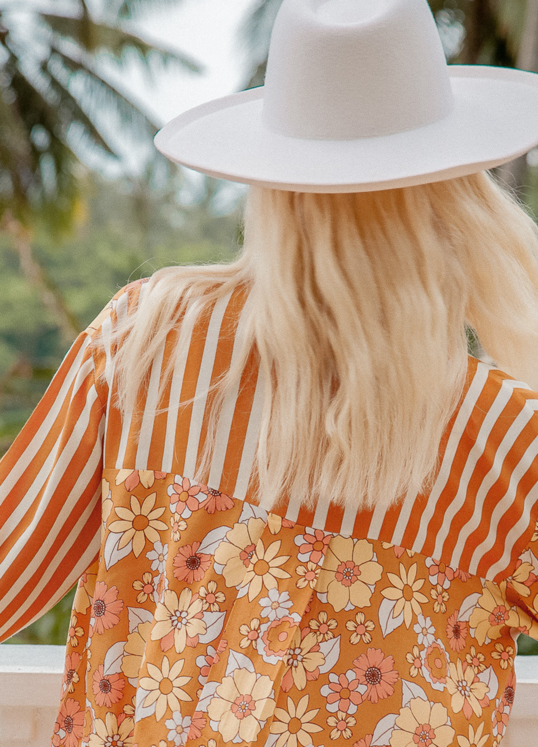 Model wearing the Sunshine Blouse from Palm Collective