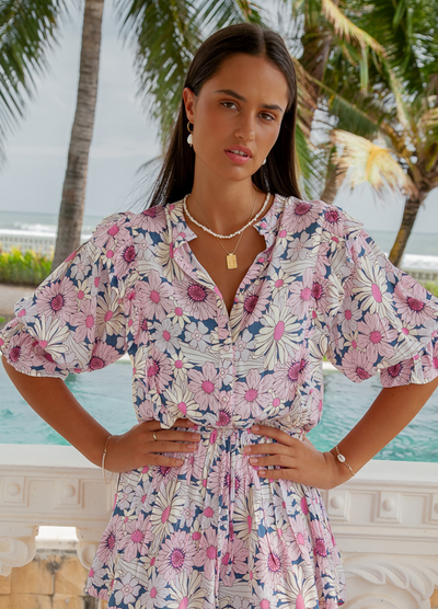 Model wearing the floral tallow playsuit from Palm Collective