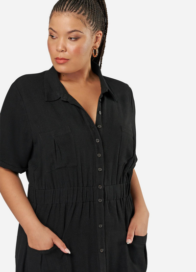 Curve model wearing a black shirt dress