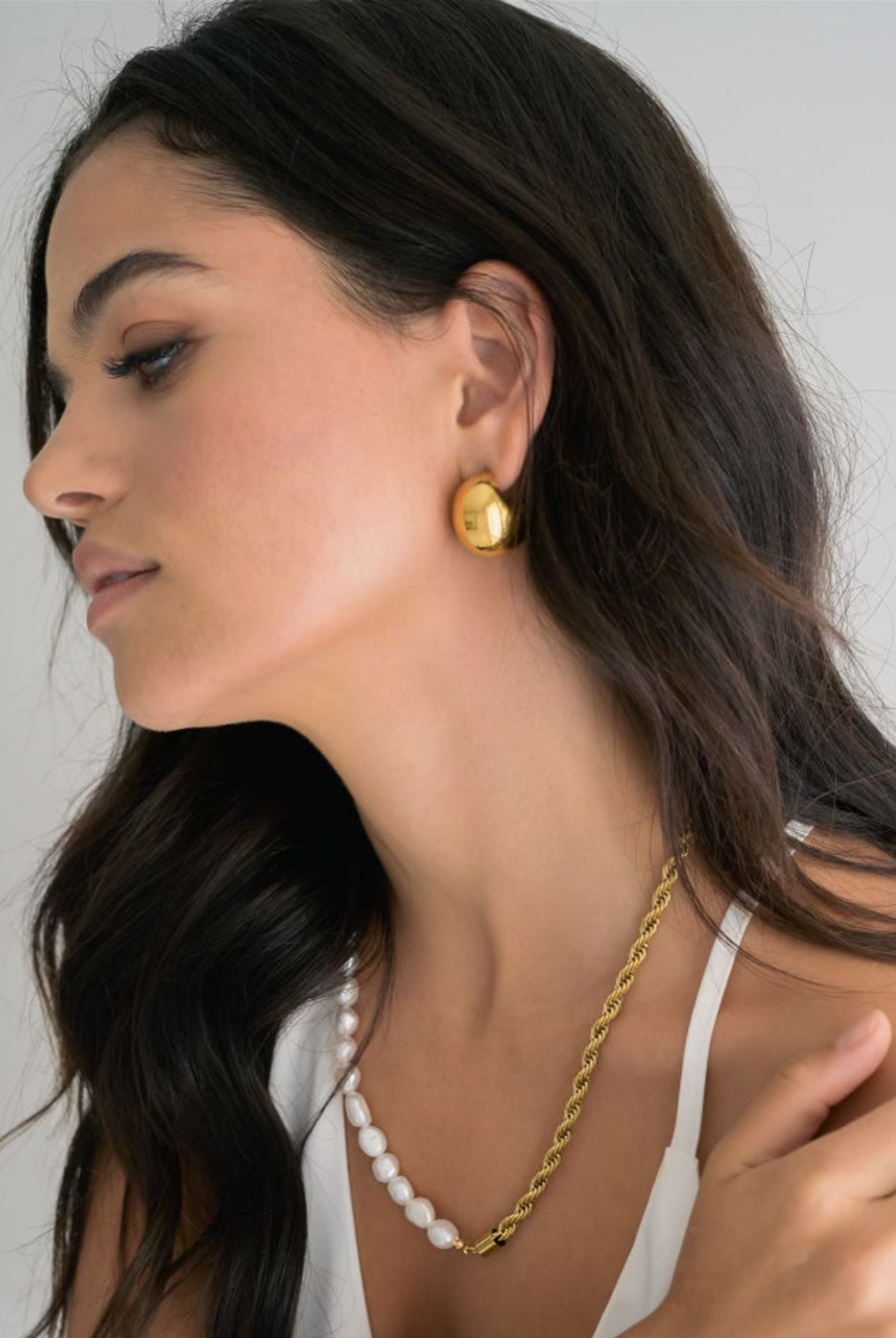 Round gold earrings from Indigo & Wolfe 
