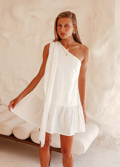 White one shoulder mini dress with bow at shoulder