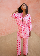 Model wearing the spanish sun pants in pink and red