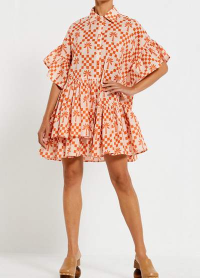 Model wearing the Bohemian Traders Genoa Dress in Palm Check Print