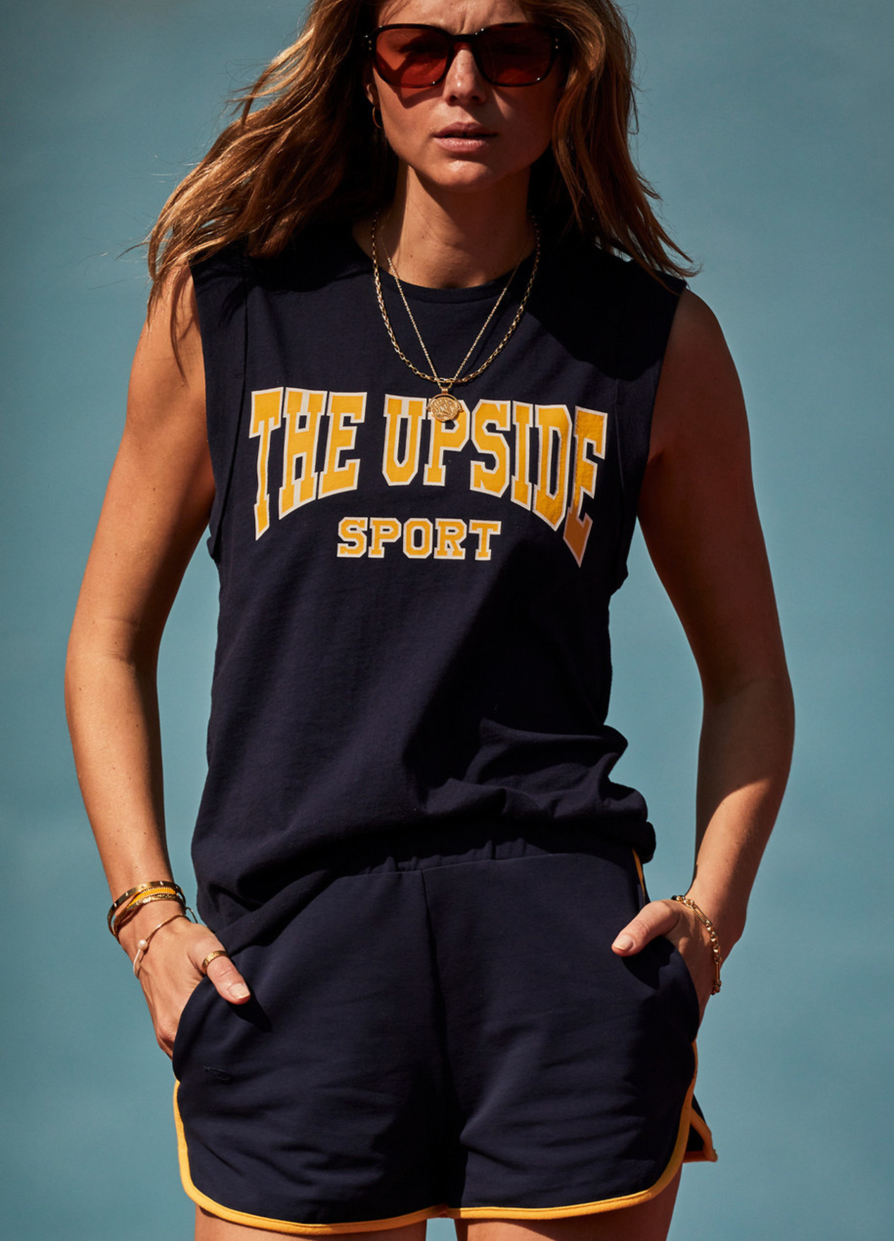 The Upside Ivy Leage Tank in navy with yellow and white logo design