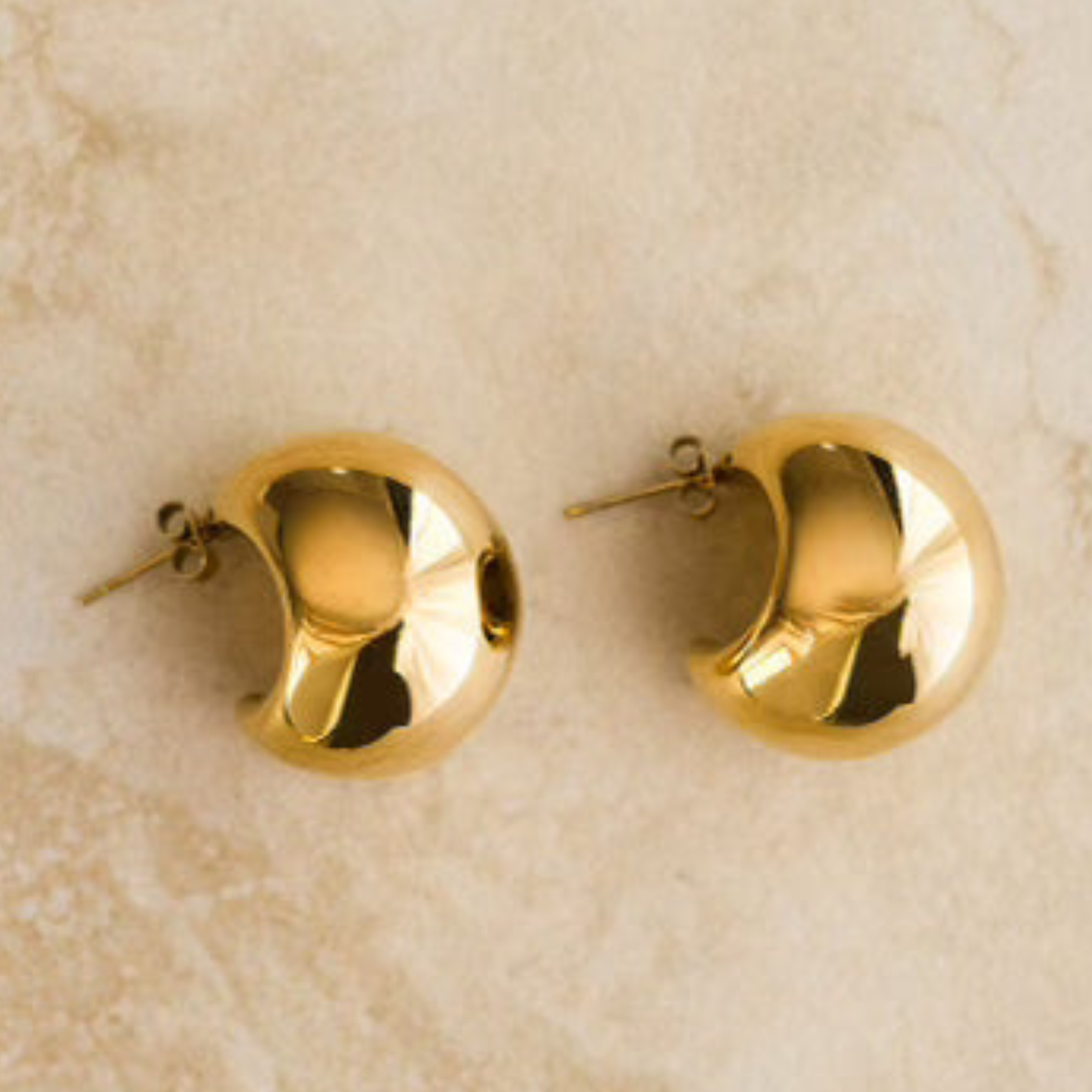 Round gold earrings from Indigo & Wolfe