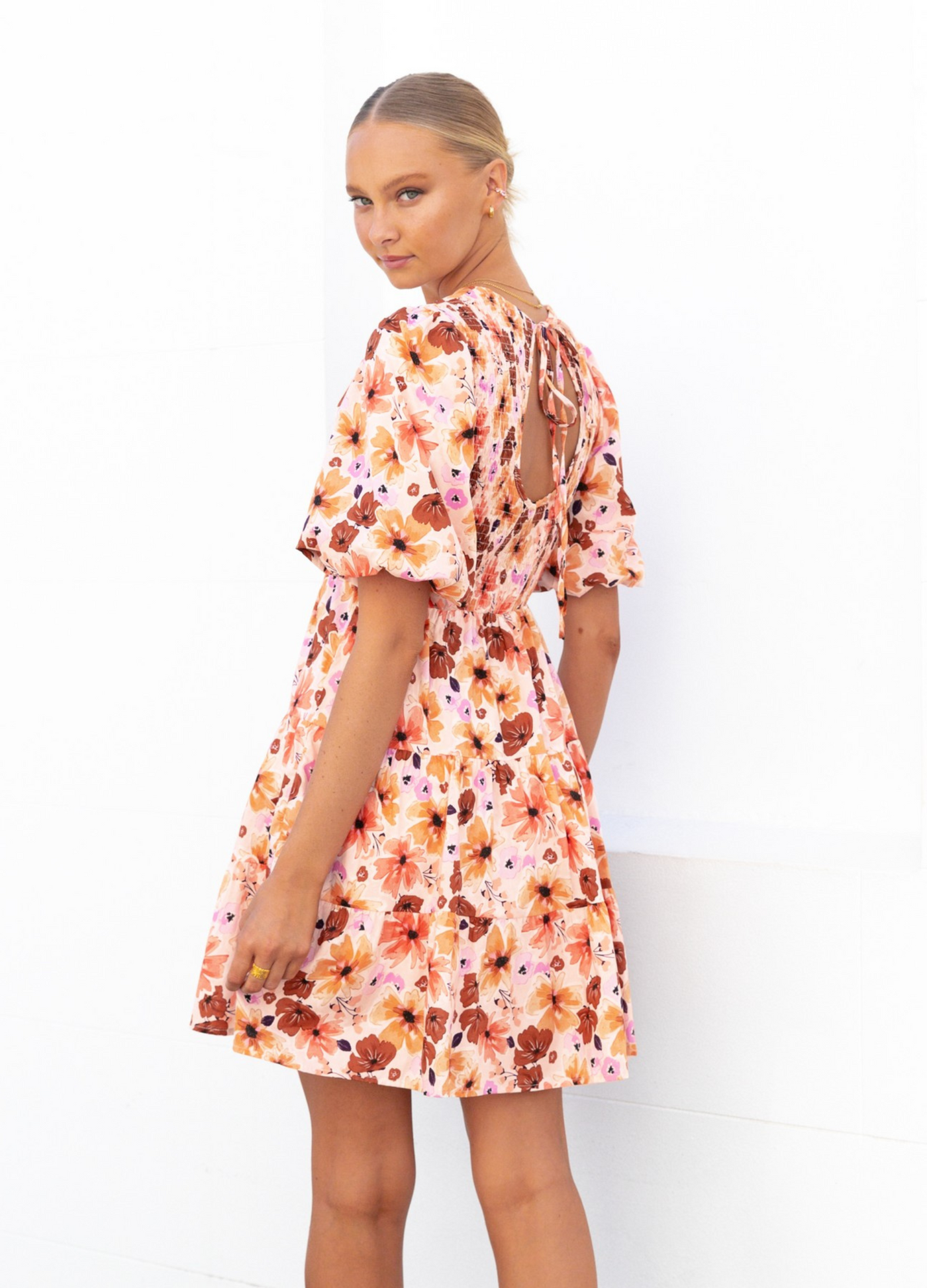 Model wearing the Paper Heart Maeve Mini Dress in Floral Print