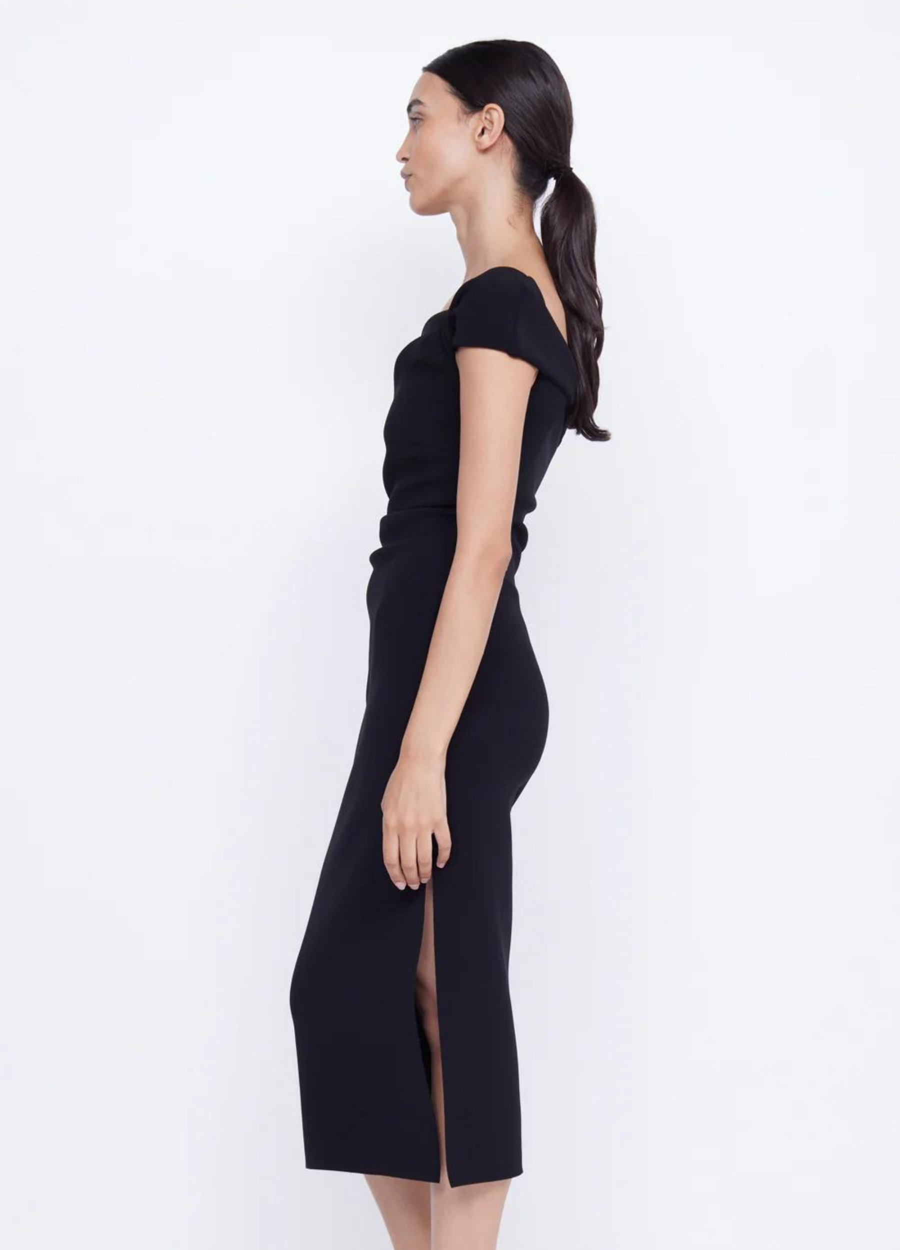 Black bonded crepe midi dress with twisted front and side tuck detailing