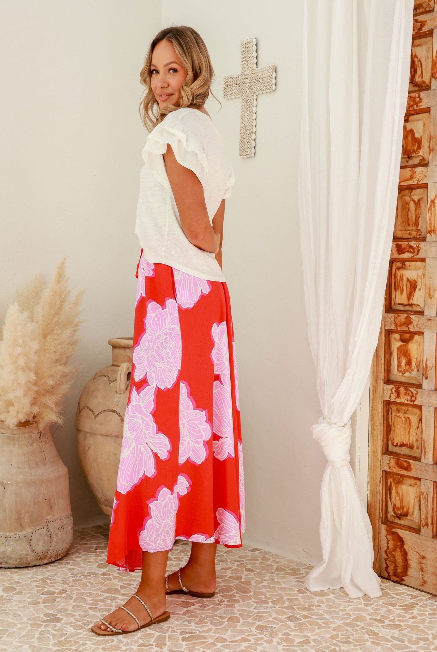 Red base floral midi skirt with white and pink flowers and ties at the waistband