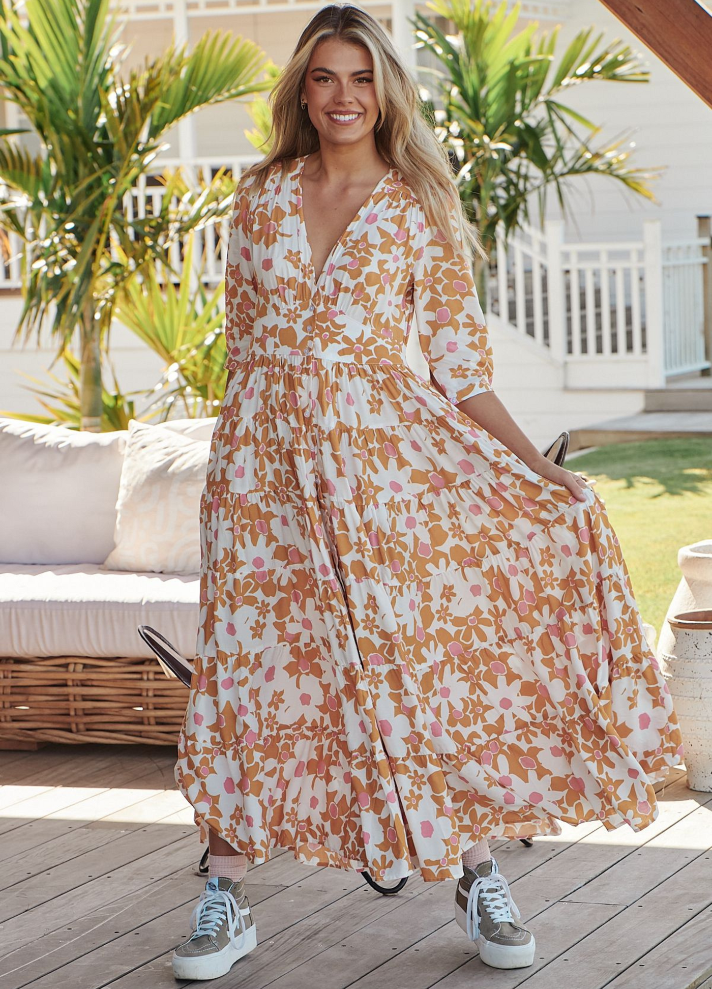 Model wearing the Jaase Berry Maxi Dress in floral print viscose fabric button detail front