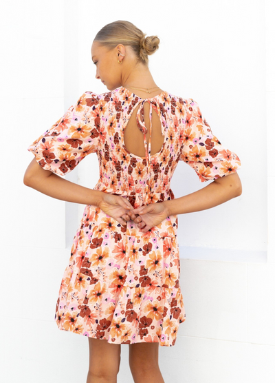 Model wearing the Paper Heart Maeve Mini Dress in Floral Print