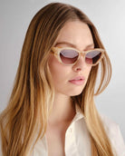 Blonde woman wearing the Sydney Sunglasses from Luv Lous