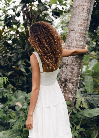 Model wearing the white Ashlyn Dress from Girl and the Sun