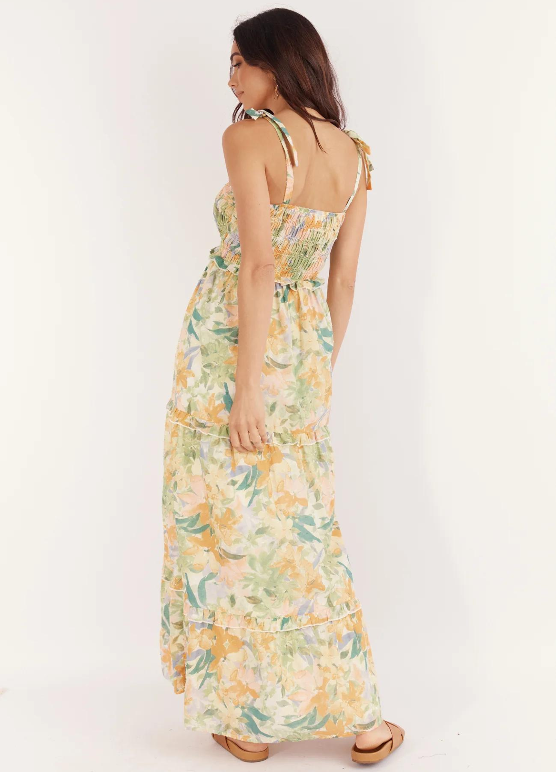 Model wearing the Yelena floral print dress with tie shoulders