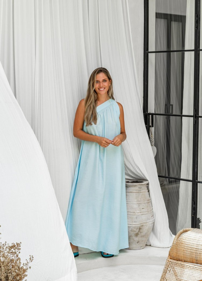 One shoulder baby blue dress in crease resistant fabric with matching belt
