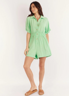 Pretty green playsuit with button through front and short sleeves