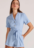 Model wearing pale blue playsuit from Staple the Label
