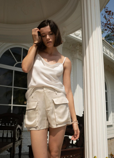 Model wearing the Anaphe Silk Shorts in neutral