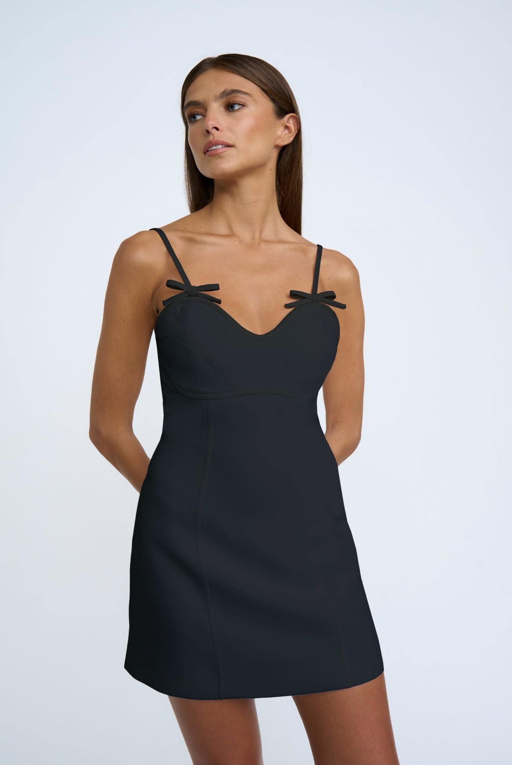 Model wearing the Bettina Bow Shift Dress in Black