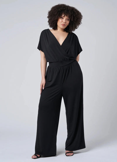 Black jersey jumpsuit with wrap top detail and low back