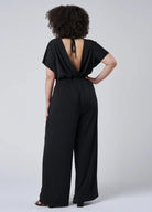 Black jersey jumpsuit with wrap top detail and low back