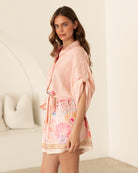 Luciana Playsuit from Ebby and I woman wearing it on a white background
