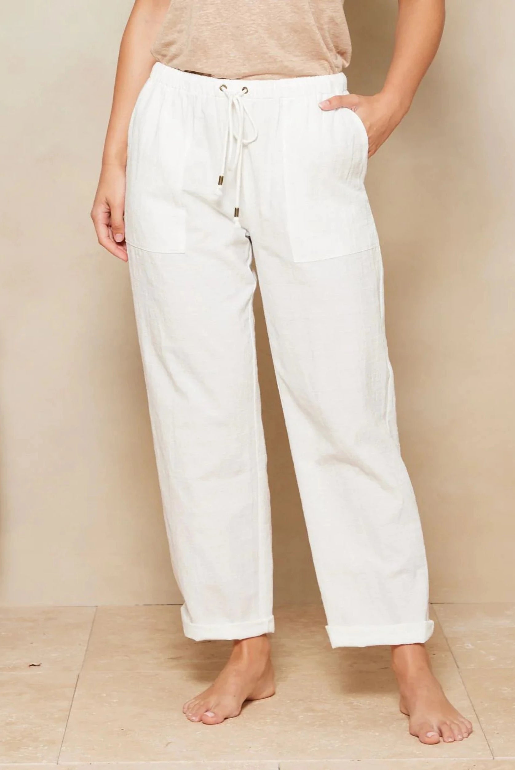 White Cotton beach pant from Tigerlily with patch pockets and a drawstring waistband