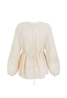 Beige blouse with long sleeves on a white background