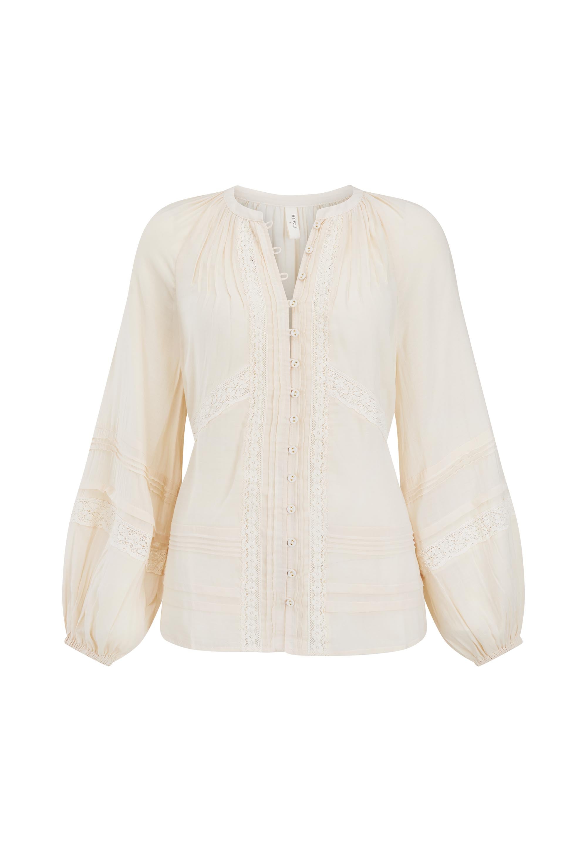 Cream-colored blouse with long sleeves on a white background