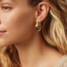 Gold statement earrings from Jolie & Deen