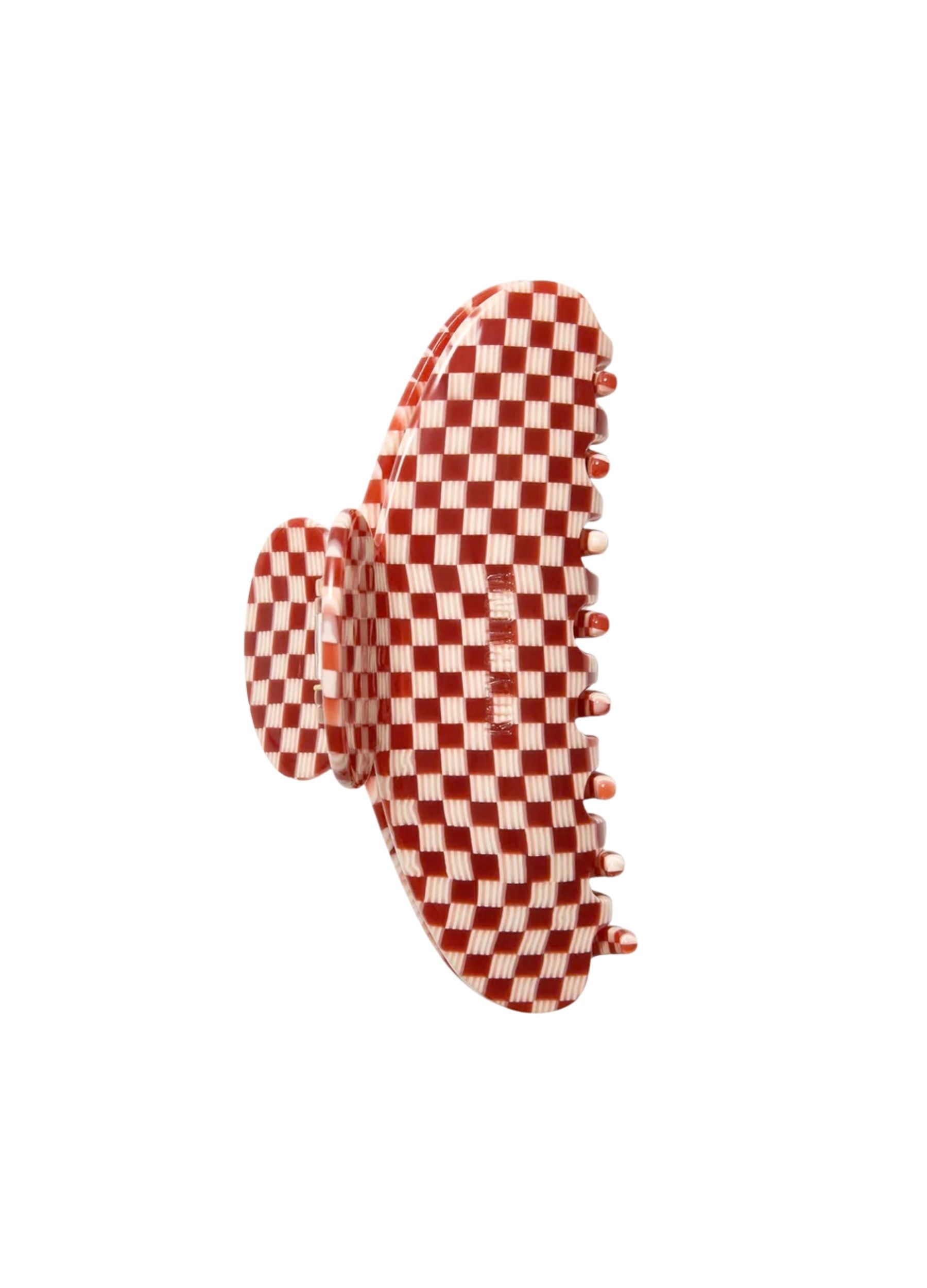 Red and white checkered hair clip on a white background