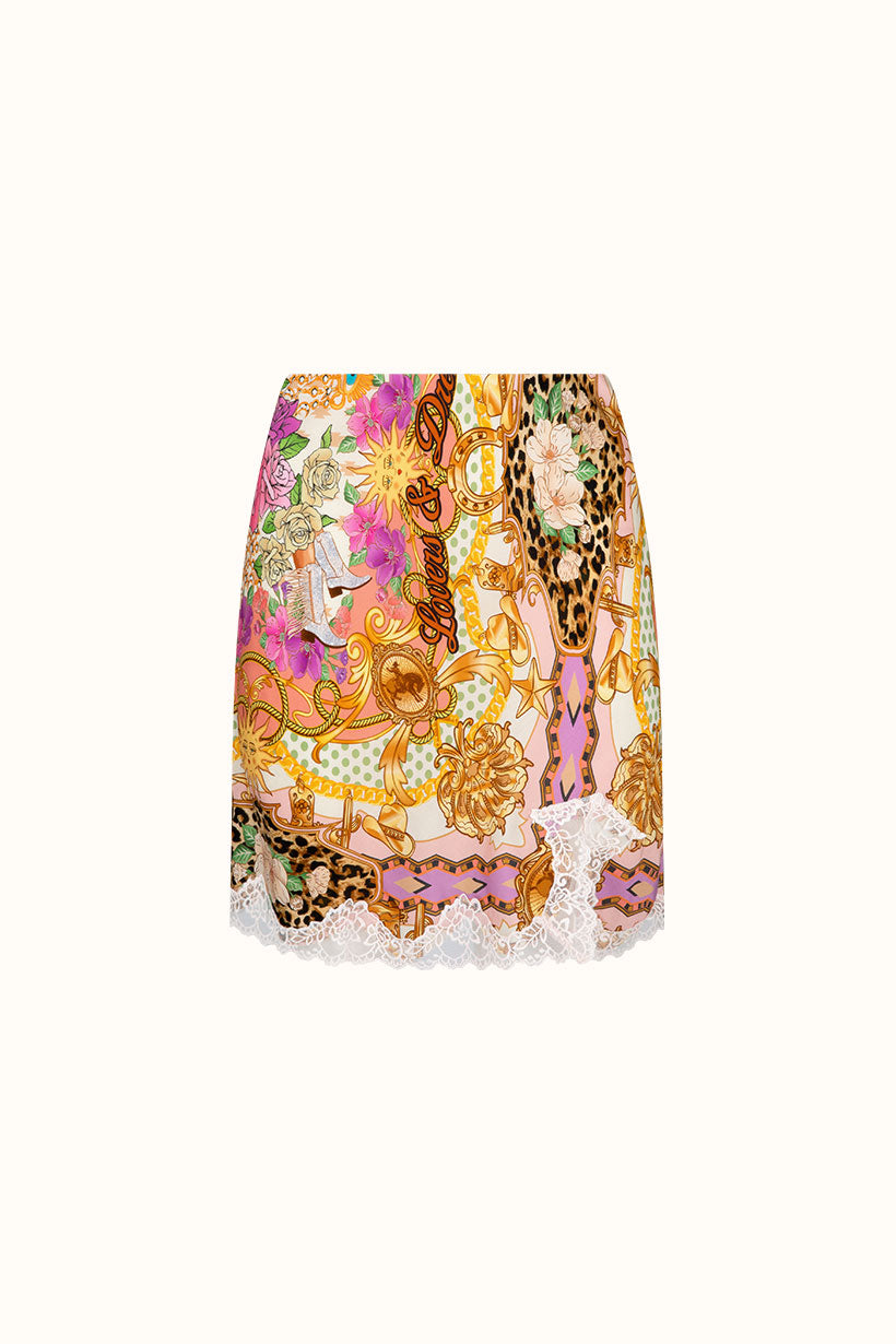Colorful patterned skirt with floral and animal print on a white background